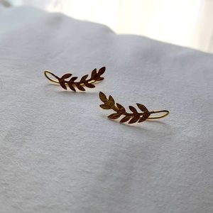 Noonday Collection Peruvian made gold colored “ear climber” earrings.